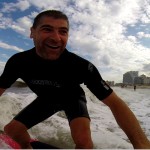 Close up of guy having fun while surfing